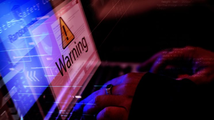 Ominous photo of a computer screen with an alert.